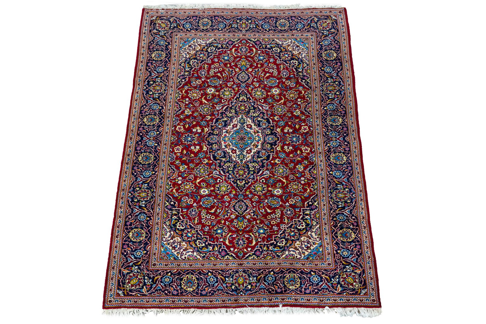 RED FIELD AREA RUG: with a central medallion 6'6" x10'