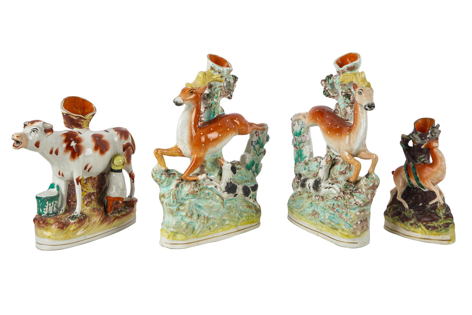 GROUP OF STAFFORDSHIRE POTTERY: umarked, comprising four animals Condition: with loss to antler on deer; paint loss throughout the pair: 10 3/4 inches high