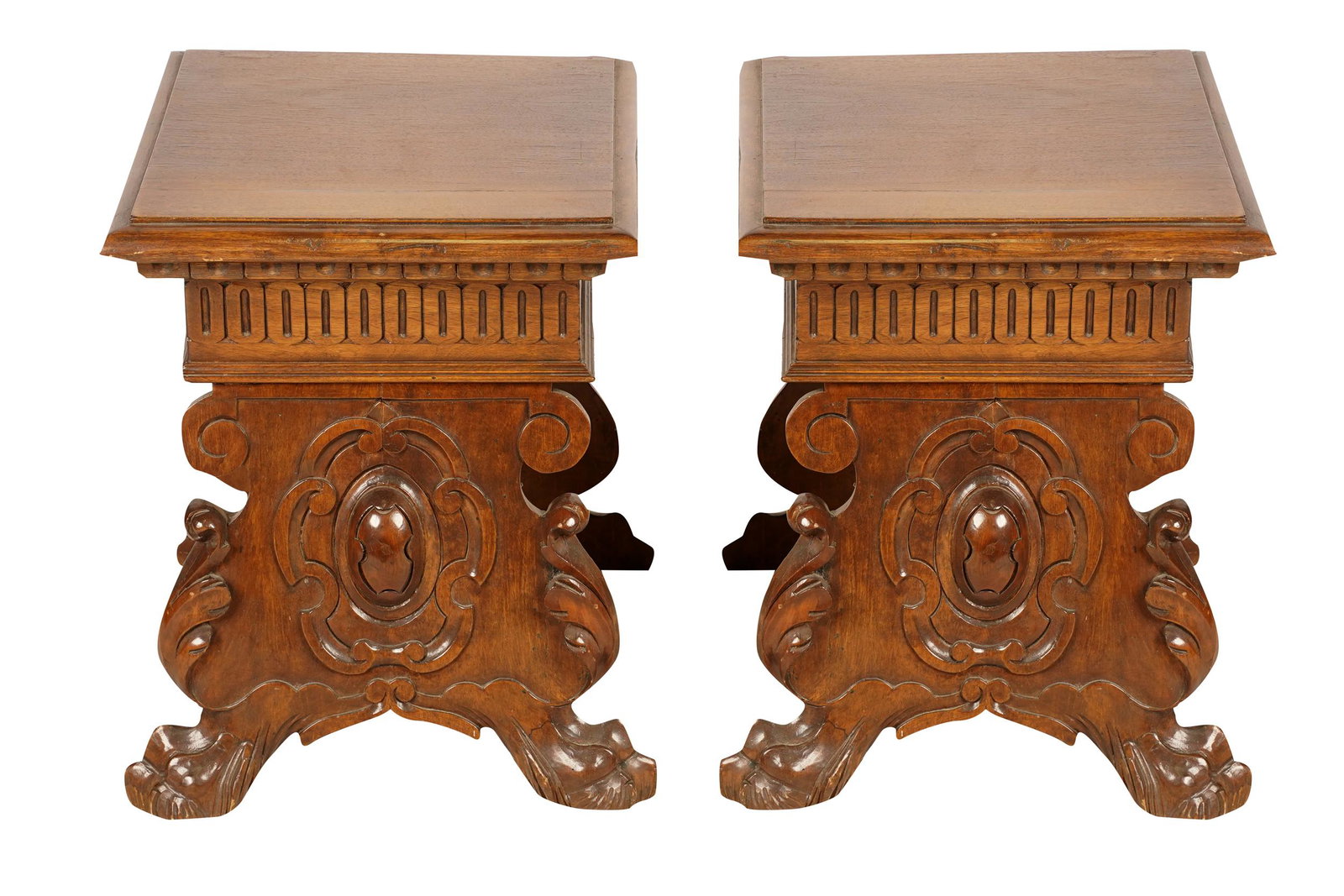 PAIR OF RENAISSANCE STYLE END TABLES: 20th century, each with square hinged lid lifting to reveal a storage compartment, raised on a pair of panel supports joined by a stretcher each 15 1/2 inches wide; 15 1/2 inches deep; 19 inches high