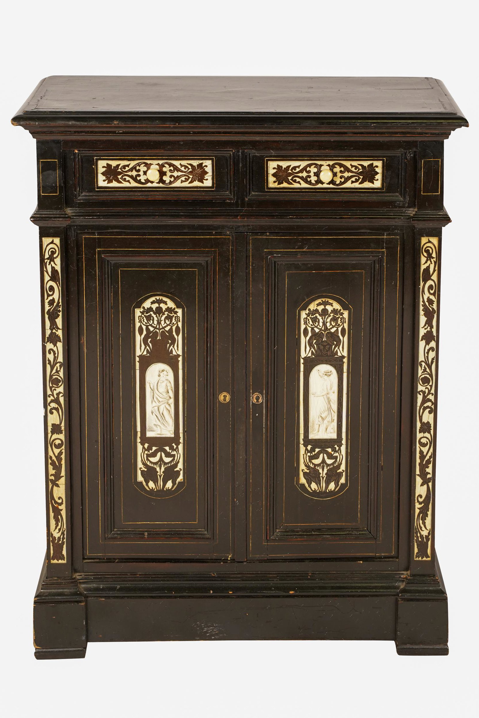 ITALIAN BONE-INLAID EBONIZED WOOD CABINET: having a rectangular top over two short drawers above a pair of hinged doors Condition: no key. Scattered marks, scratches and nicks. Wear along edges. Cracks to bone. 27 1/4 inches wide; 12 1/4 inche