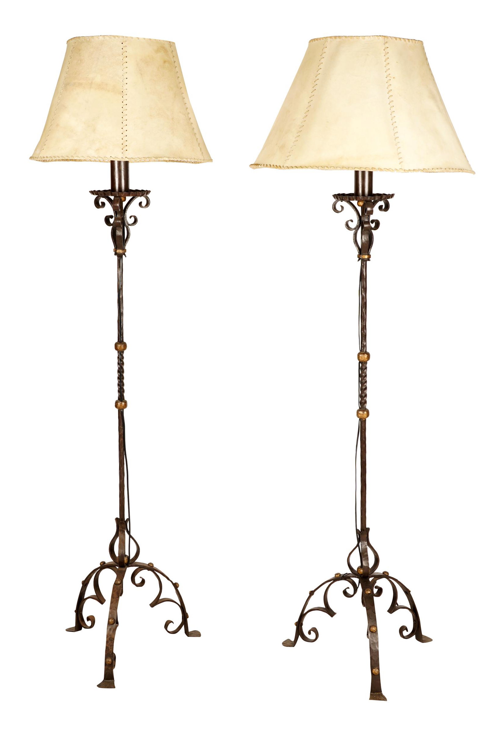 PAIR OF WROUGHT IRON FLOOR LAMPS: each with a hide shade 71 inches high