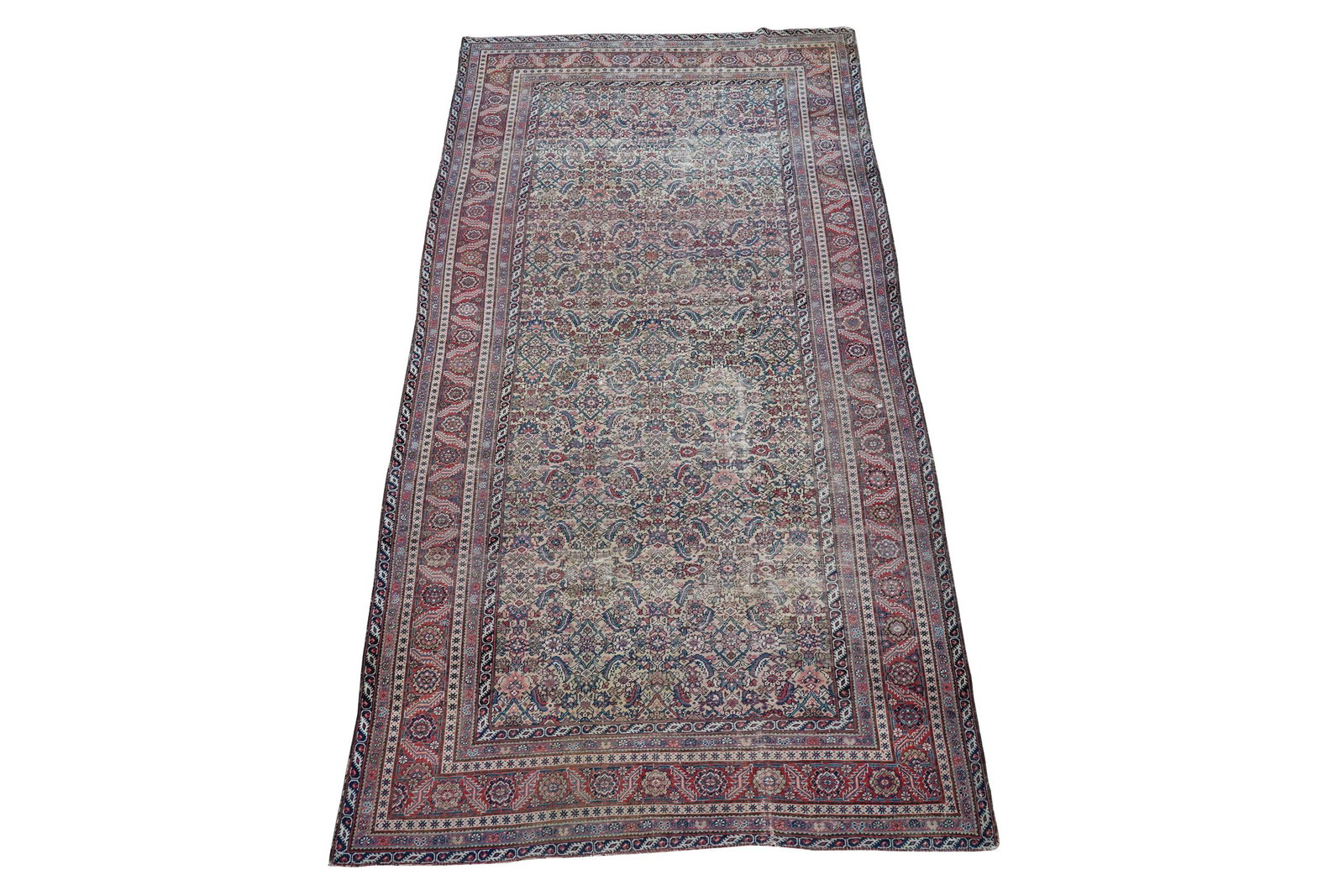 PERSIAN AREA RUG: Condition: with shaved down pile and even wear throughout 6'6" x 12'2"