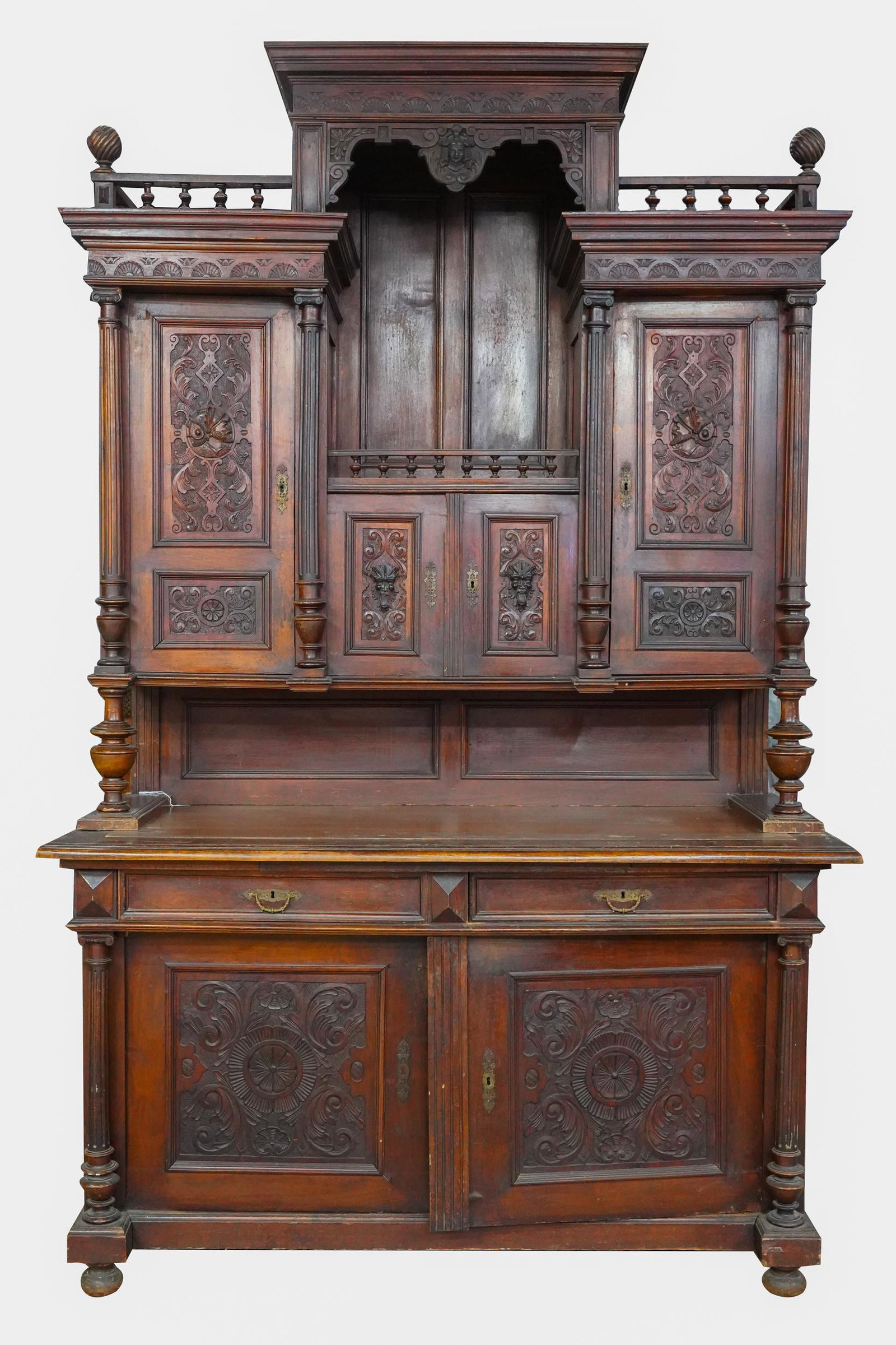 CARVED TWO-PART BUFFET: Condition: with surface scratches and general wear throughout 63 inches wide; 26 inches deep; 99 inches high