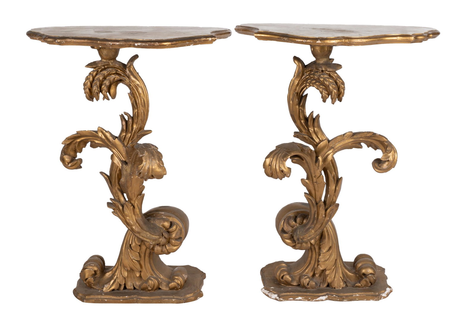 PAIR OF ROCOCO STYLE GILTWOOD STANDS: each with asymmetrical serpentine top Condition: each with significant repairs, losses and wear to paint. Splits to bases. Both wobble. 25 3/4 inches wide; 19 1/4 inches deep; 35 inches high