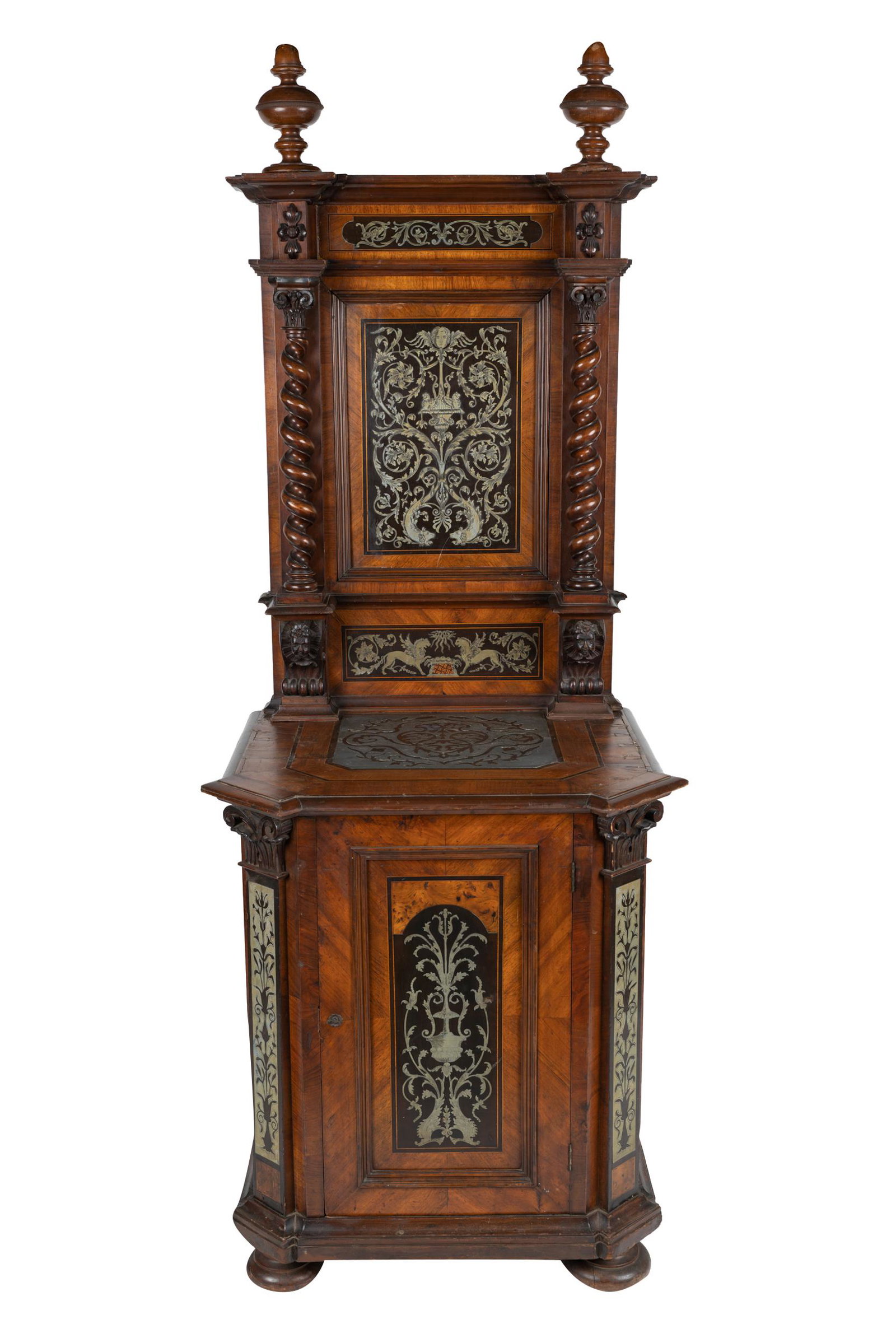 MARQUETRY-INLAID NARROW CABINET: the tall back with metal marquetry-inlaid panel flanked by twisted columns, over a conformingly inlaid cabinet with angled corners and fitted with a drawer over a hinged door Condition: with lifting t