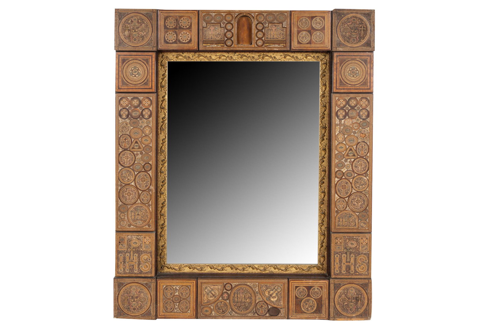 INLAID WOOD MIRROR: decorated with Catholic symbols Condition: with losses throughout and lifting to veneer 35 1/4 x 29 1/2 inches