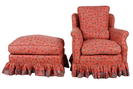 CLUB CHAIR & OTTOMAN: with loose seat and back cushion and one throw pillow, covered with red floral print cotton fabric Provenance: The Estate of Judith Krantz, Bel Air Condition: good. The chair: 30 inches wide; 29