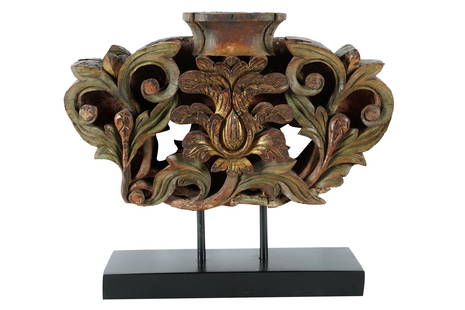 INDONESIAN CARVED & PAINTED WOOD ARCHITECTURAL FRAGMENT: mounted to a metal stand Provenance: The Estate of Judith Krantz, Bel Air Condition: only traces of paint remaining. Chips, losses, cracks and repairs. 18 1/2 inches wide; 11 1/2 inches high; 16