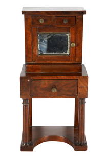 DIMINUTIVE AMERICAN LATE CLASSICAL MAHOGANY CABINET: with two drawers over a hinged mirrored door concealing two drawers, on an outset base with a single frieze drawer Provenance: The Estate of Judith Krantz, Bel Air 6 3/4 inches wide; 4 3/4 inches
