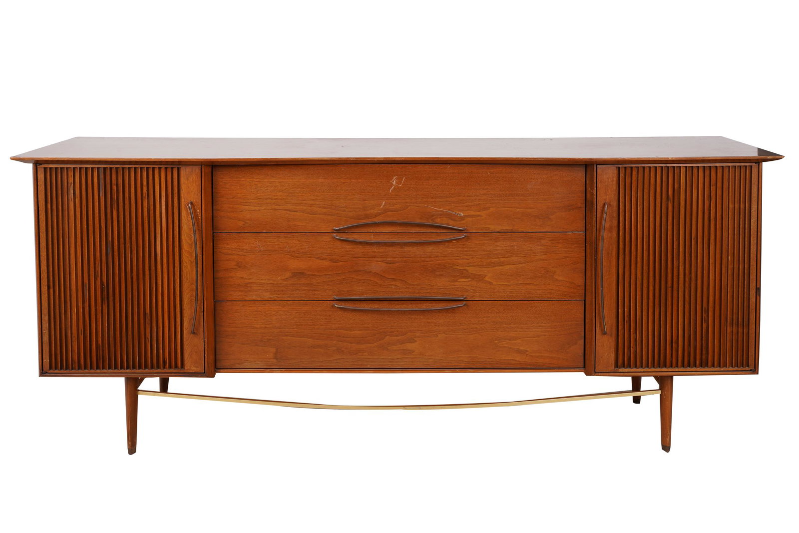 HELEN TOBEY BAKER: CREDENZA: 1950s, with signature and Baker-Levett stamp to interior of top drawer; having three long drawers flanked on each side by a hinged door concealing three short drawers Condition: nicks and wear along e