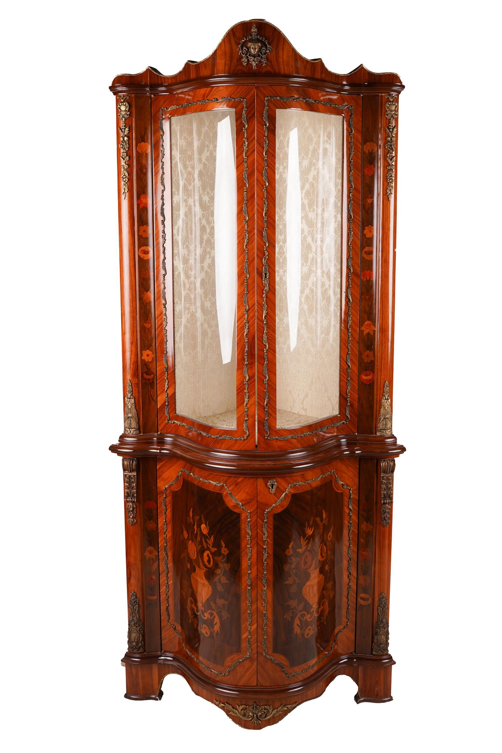 MARQUETRY CORNER VITRINE CABINET: late 20th century, stamped to back "Made in Italy", with gilt metal mounts, constructed in two parts, the upper part with a pair of hinged, glazed doors enclosing a silk damask-lined interior with two
