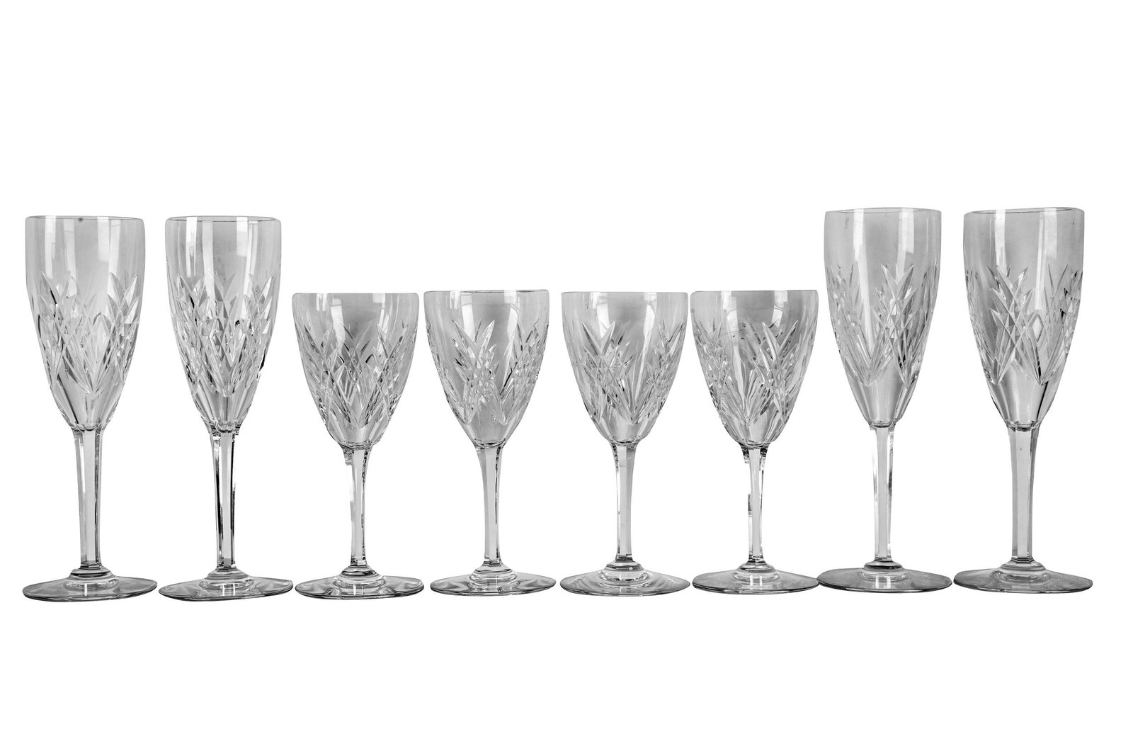 SET OF BACCARAT CRYSTAL STEMWARE: marked to undersides, comprising 11 flutes (8 1/2 inches); and ten wine glasses (6 1/2 inches) [21 pieces] Condition: one wine glass with a chip to mouth rim; another wine glass with a chip to foot