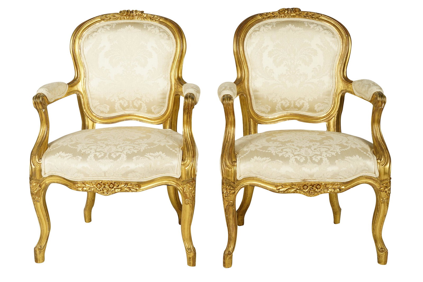 PAIR OF LOUIS XV STYLE GILTWOOD FAUTEUILS: each with white damask upholstery 23 1/2 inches wide; 36 inches deep; 35 1/2 inches high; seat height: 17 inches