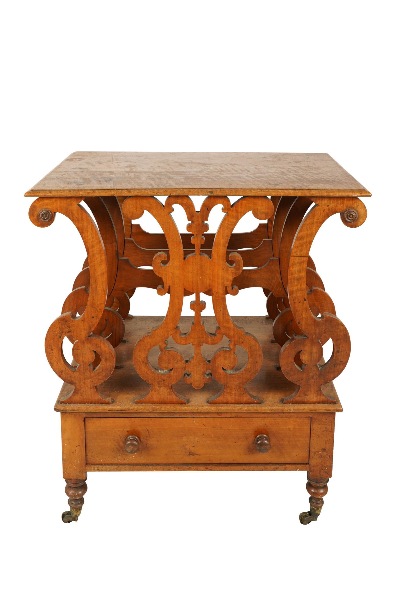 EDWARDIAN FRUITWOOD CANTERBURY: with two dividers over a single drawer 27 inches wide; 17 1/2 inches deep; 30 1/2 inches high