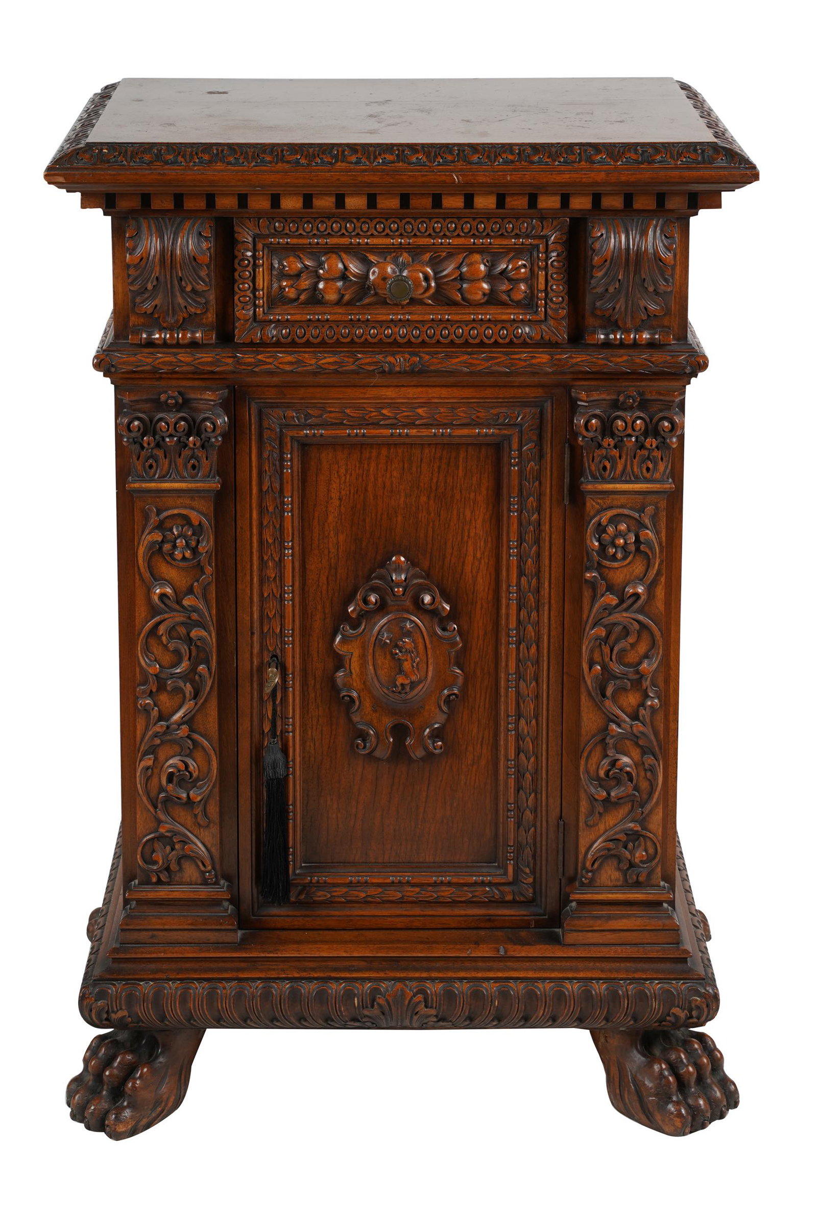 RENAISSANCE REVIVAL SIDE CABINET: single frieze drawer above a hinged door, walnut, with key Condition: scratches and scuffs to top 27 inches wide; 17 inches deep; 40 inches high