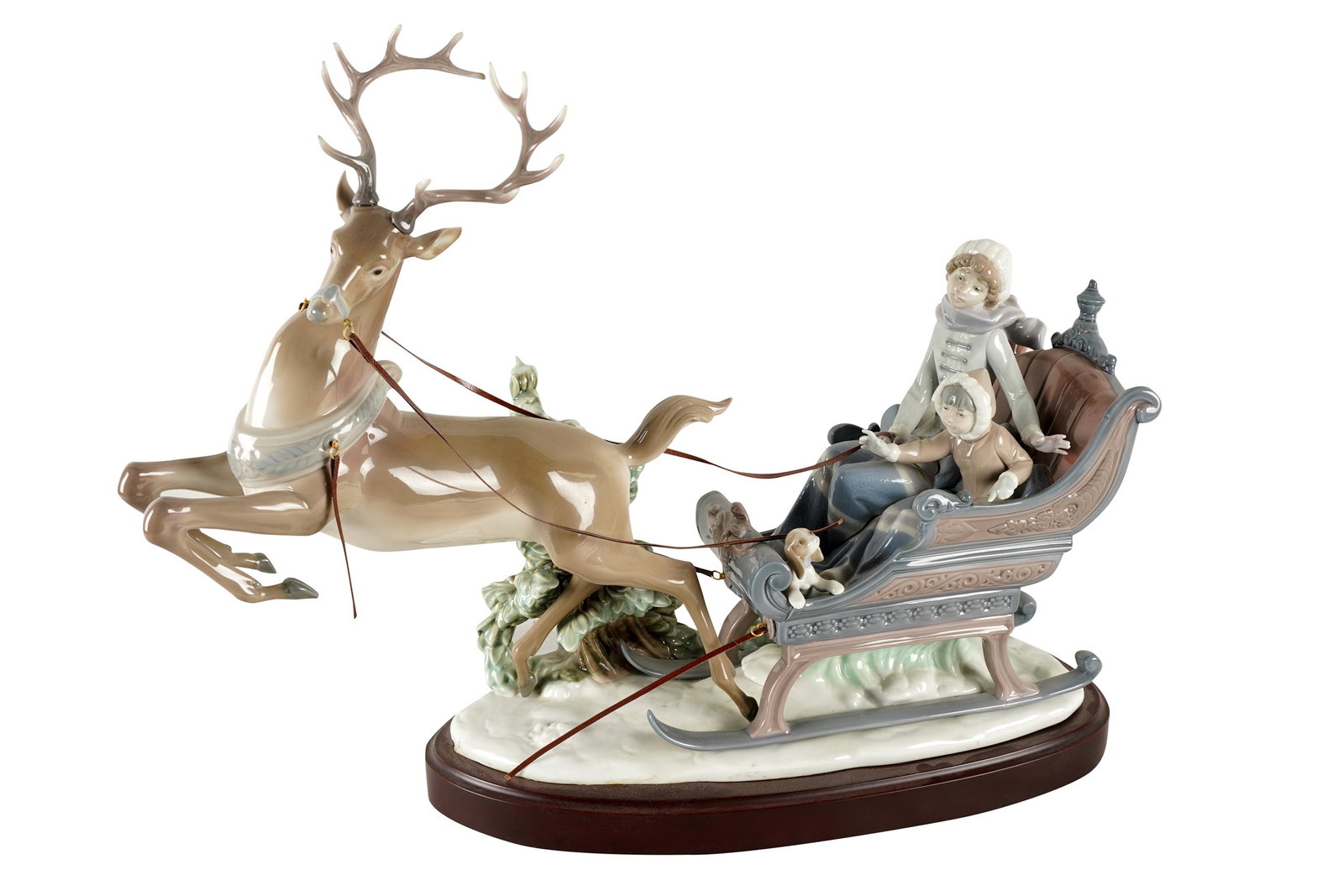 LLADRO PORCELAIN REINDEER SLED GROUP: with factory marks; on a custom wood base ; the figure: 21 inches wide; 17 total inches high on base