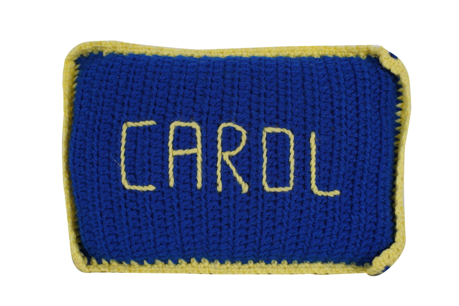 CAROL CHANNING CROCHETED "CAROL" PILLOW: rendered in yellow and blue yarn;