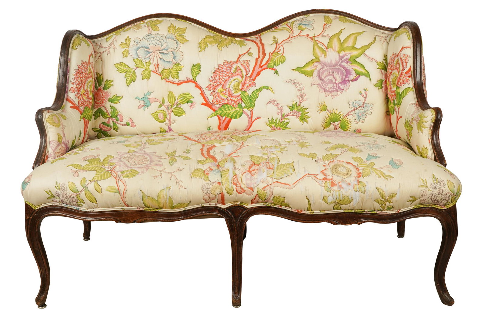 LOUIS XV STYLE CARVED WOOD CANAPE: covered with quilted floral fabric; Condition: tears and stains to fabric; nicks and scratches to frame; two metal sliders missing; extensive old insect holes to frame; Provenance: The Estate of Phili