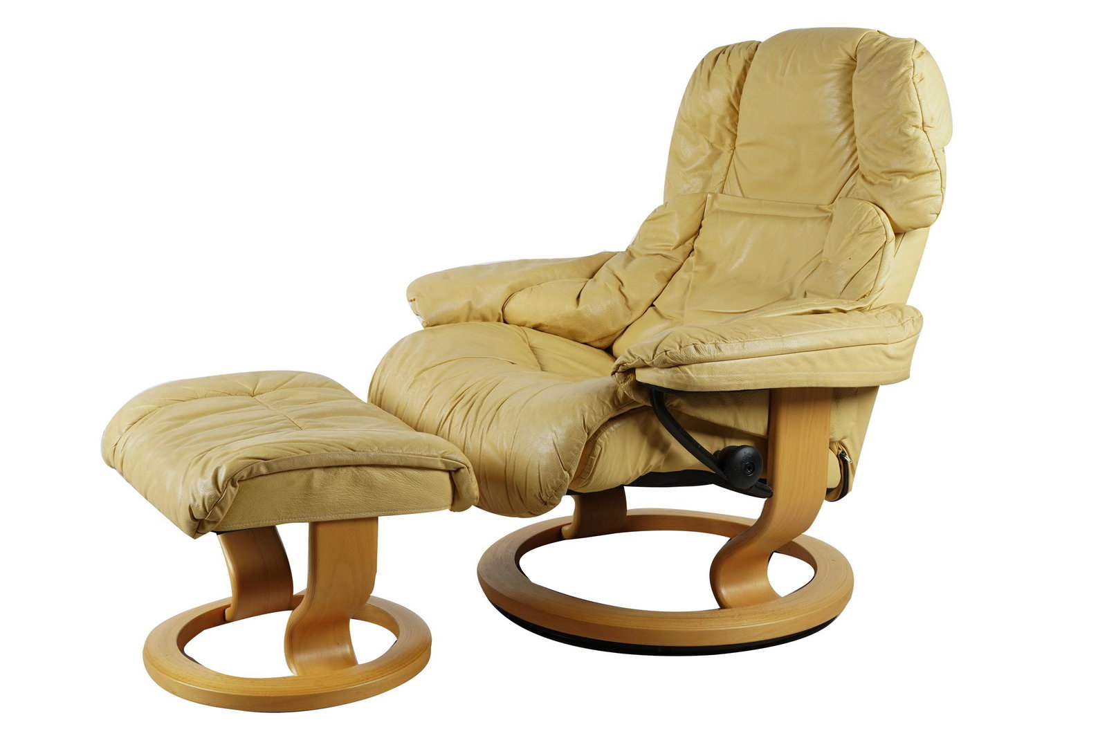 EKORNES: TAN LEATHER RECLINER & OTTOMAN: with manufacturer's label "Ekorned / Made in Norway", further marked "Stressless"; Condition: leather in need of cleaning; the chair: 34 inches wide; 32 inches deep; 37 inches high; seat height: 16 in