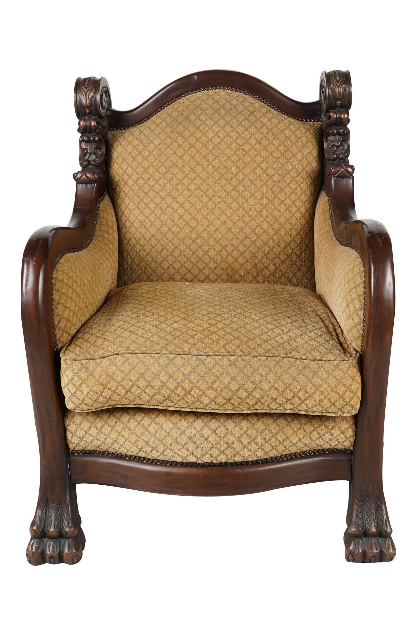 OVERSIZED CARVED WOOD ARMCHAIR: with paw feet; Condition: wear to finish on arms; fabric in good condition; 31 inches wide; 28 inches deep; 40 1/2 inches high; seat height: 21 inches