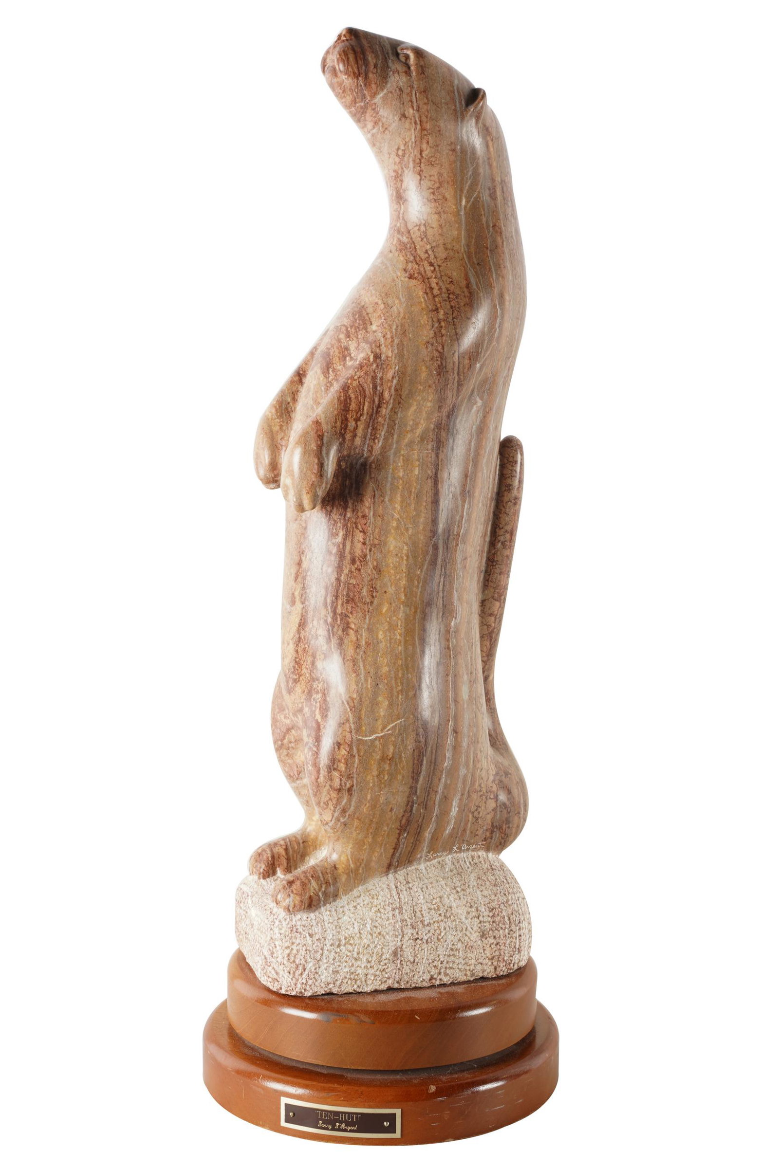 LARRY L'ARGENT (20TH CENTURY): "TEN-HUT": depicting a standing otter; carved stone; unsigned; titled to plaque; mounted on a revolving wood base; the stone: 39 inches high; 33 inches high overall