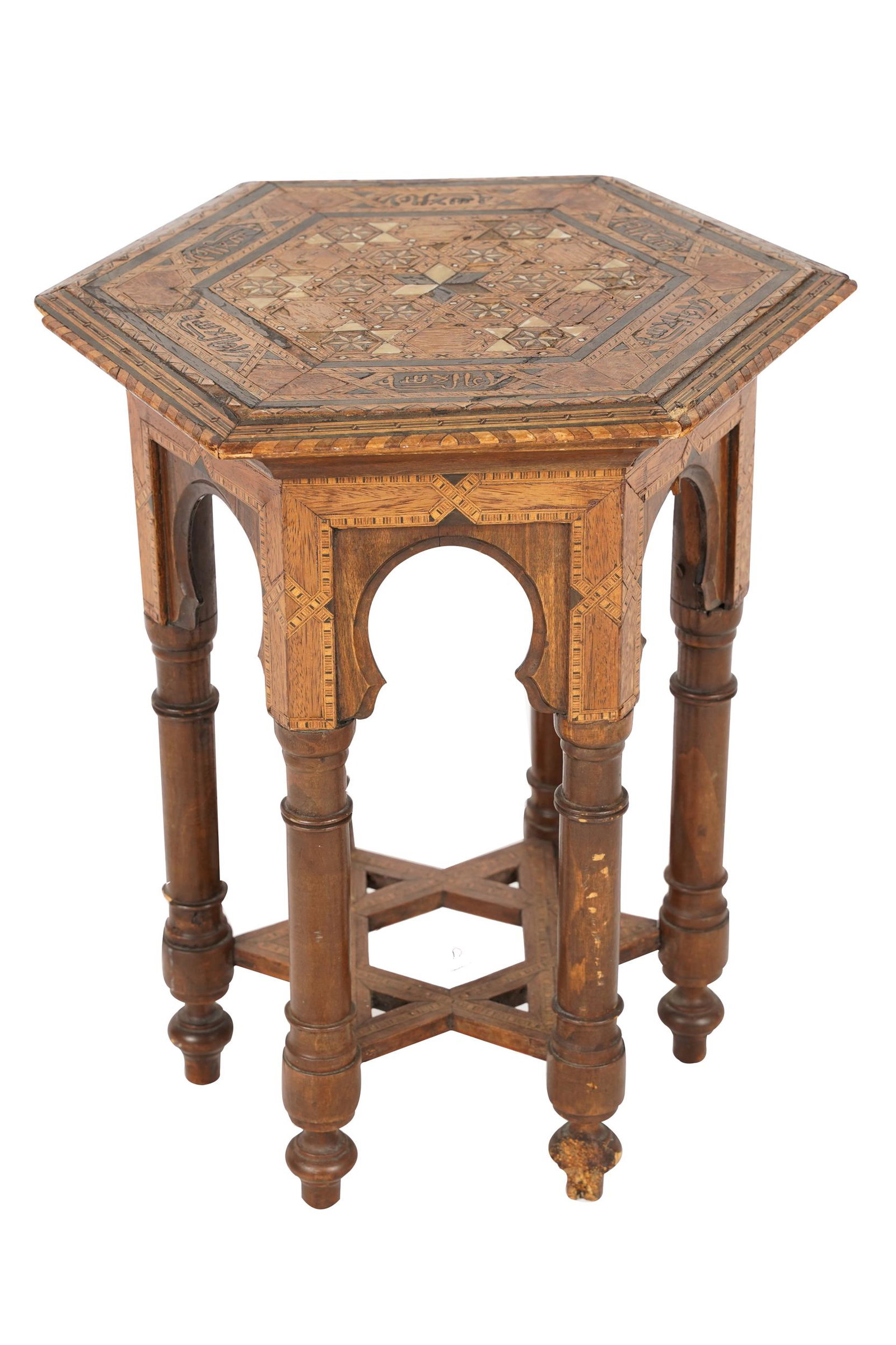 MOORISH STYLE INLAID WOOD TABORET: with hexagonal top; Condition: losses to inlay; a large loss to one foot; chips to edge of top; 16 inches diameter; 19 inches high