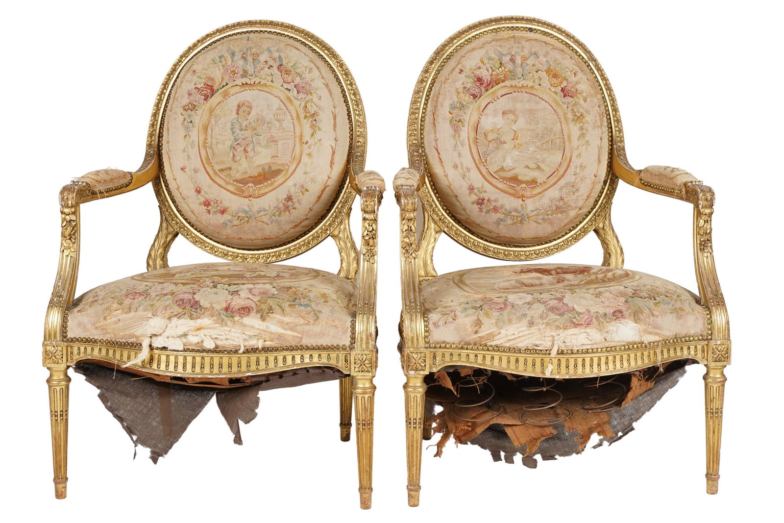 PAIR OF ANTIQUE LOUIS XVI-STYLE GILTWOOD FAUTEUILS: each with Aubusson tapestry upholstery; Condition: tears to fabric on rear; fading, tears and wear to tapestry; chips and wear to gilding revealing red bole and white gesso; 28 inches wide; 24 inches 