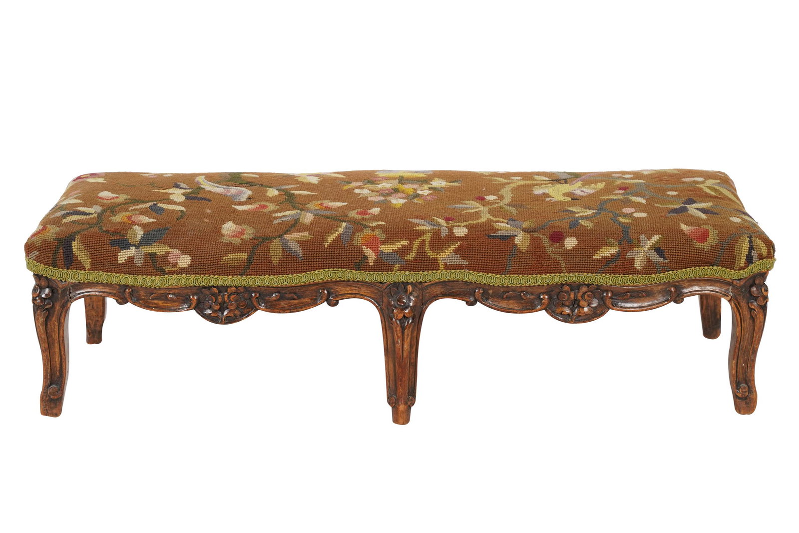 LOUIS XV PROVINCIAL STYLE FRUITWOOD FOOTSTOOL: covered with bird-motif needlepoint; 32 inches wide; 13 inches deep; 8 inches high