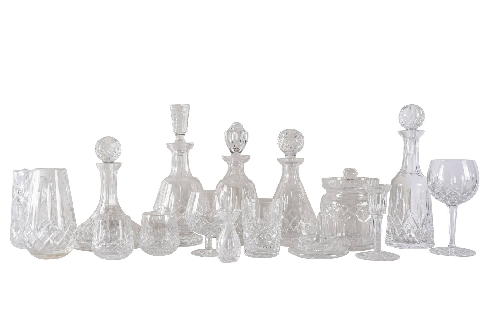 WATERFORD 'LISMORE' CRYSTAL SERVICE: signed, comprising: 8 brandy snifters (5 1/4" high); 8 goblets (7 5/8" high); 8 double old fashioned (4 3/8" high); 7 tumblers (3 1/2" high); 1 covered biscuit jar (7 inches high); 1 decanter (10 1/2"