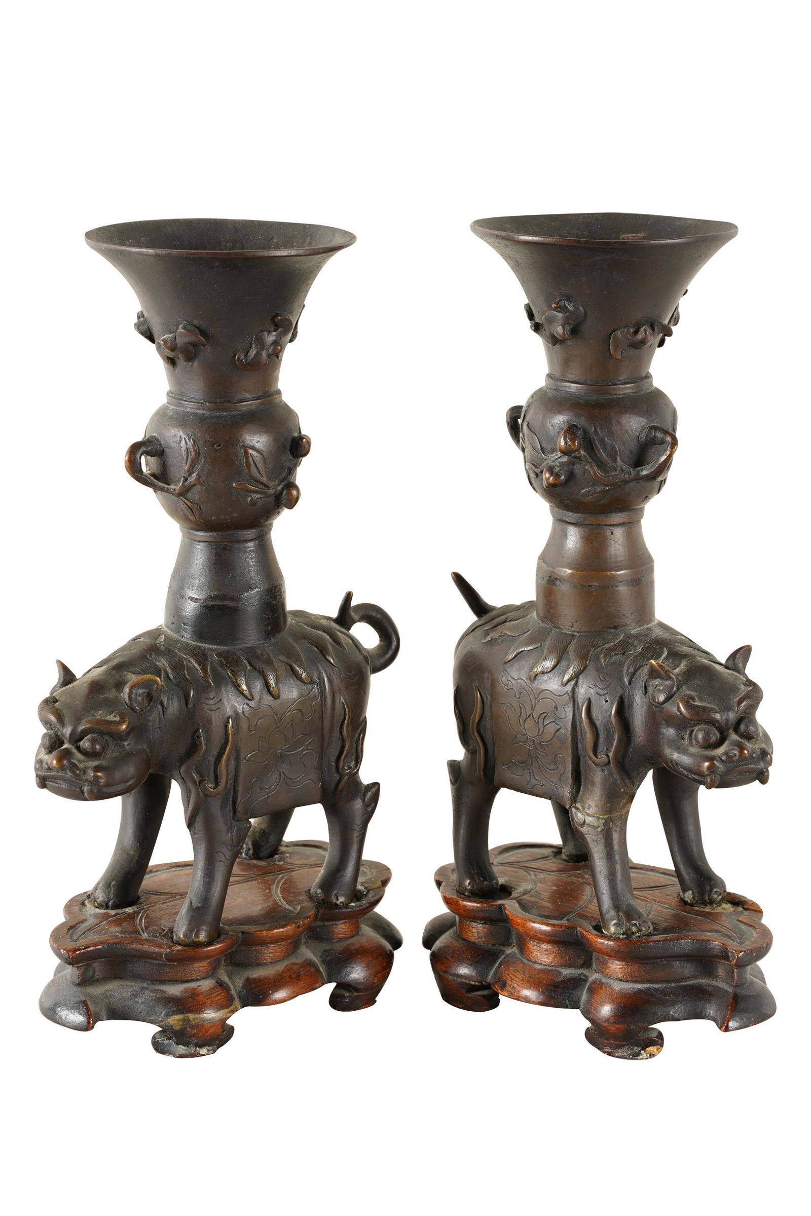 PAIR OF CHINESE BRONZE FOO DOG JOSS STICKS: on fitted wood bases; Provenance: tag from Michael Davis; 9 3/4 inches high; the base: 6 inches wide; 11 1/2 inches high overall