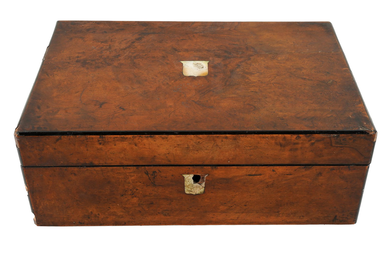 BURL WRITING BOX: the hinged lid inset with a mother-of-pearl shield, opening to an unlined interior with raised pen tray; Condition: missing key escutcheon and lock; no key; a crack to lid; chipped losses along edges;