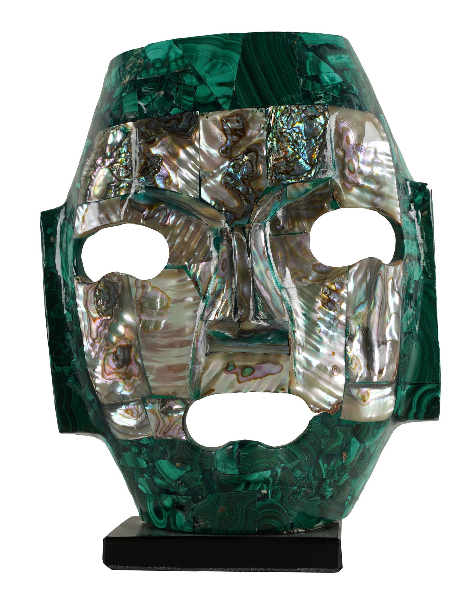 PRIMITIVE-STYLE MALACHITE MASK: with mother-of-pearl inlay; mounted to a black stone base; Provenance: The Estate of Henry and Lillian Mosauer; 4 3/4 inches wide; 5 3/4 inches high; 2 1/4 inches deep