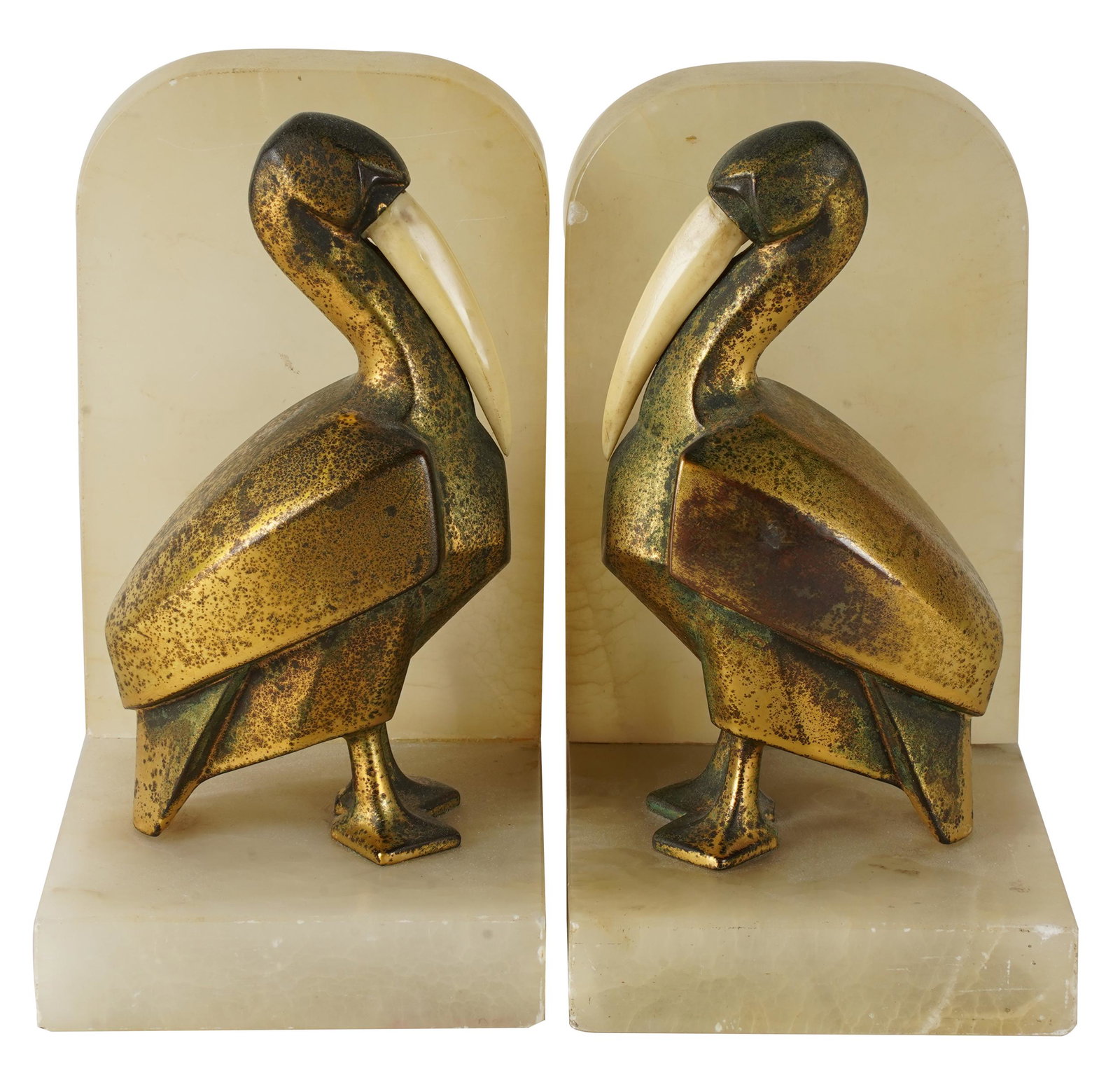 PAIR OF ONYX & BRONZE PELICAN BOOKENDS: with bone beaks; Provenance: The Estate of Barry Tarlow,Condition: oxidation to bronze; slight scuffs and nicks to onyx; 4 1/4 inches wide; 3 1/2 inches deep; 6 1/2 inches high