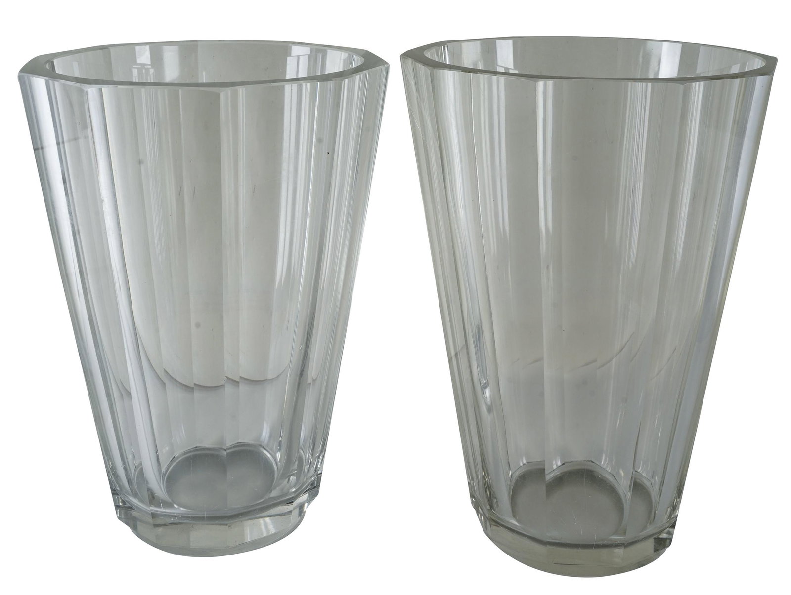 TWO HEAVY CRYSTAL VASES: unsigned, possibly Czech; Provenance: The Estate of Barry Tarlow; Condition: no chips or cracks; scratches to undersides and tops of rims; each 8 1/2 inches diameter; one 12 inches high; the other 12 