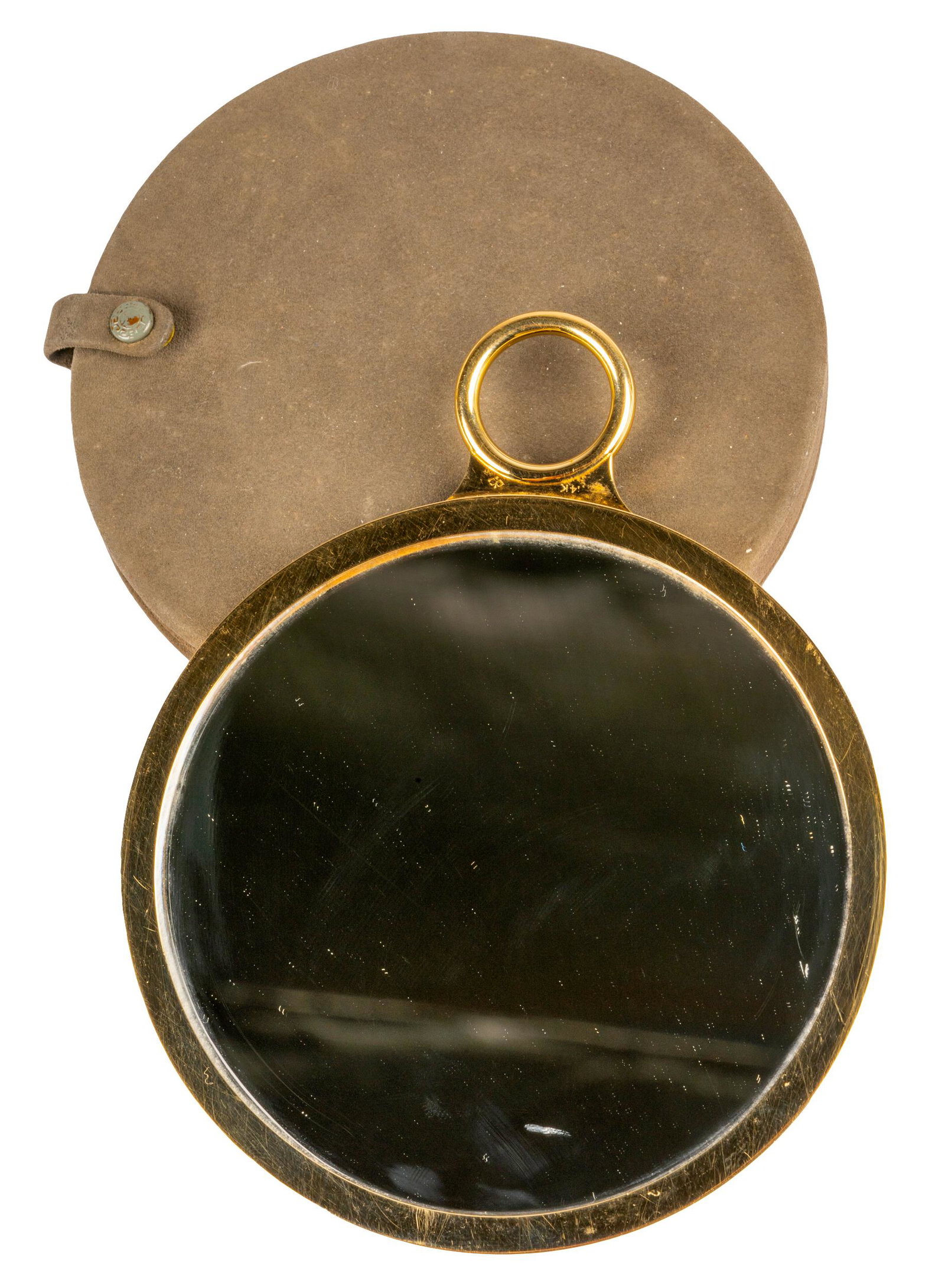 14 KARAT YELLOW GOLD HAND MIRROR: the back engraved 'To Mary / with love'; the handle stamped '14k' with possible maker's mark; 124.00 grams total; Note: with a fitted case; Provenance: The Estate of Mary Livingston Benny, wife of Jac