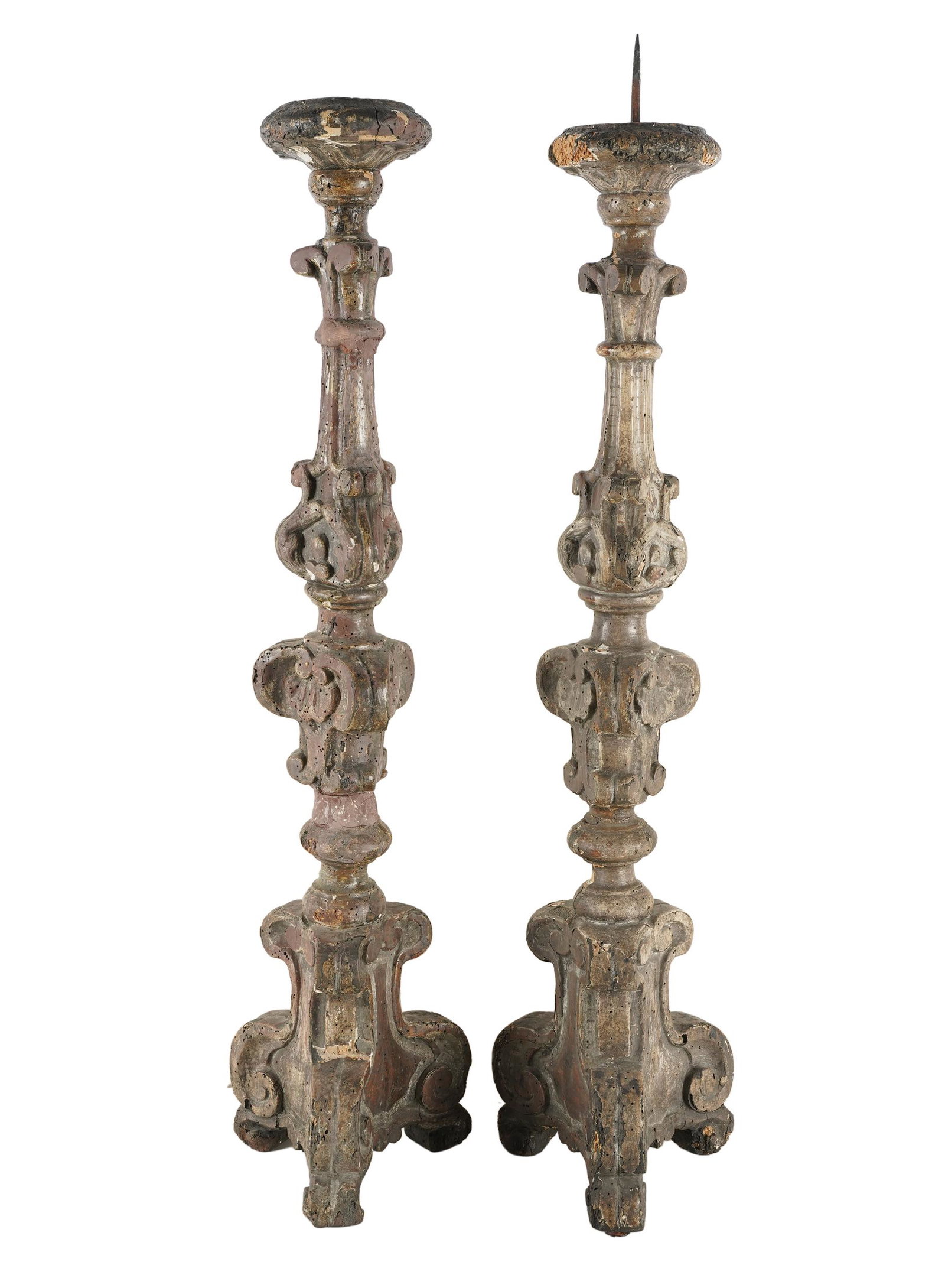 PAIR OF WOOD CARVED ALTAR STICKS: Condition: with heavy repairs and loss; beetle holes throughout; one iron top pricket missing; 34 1/2 inches high