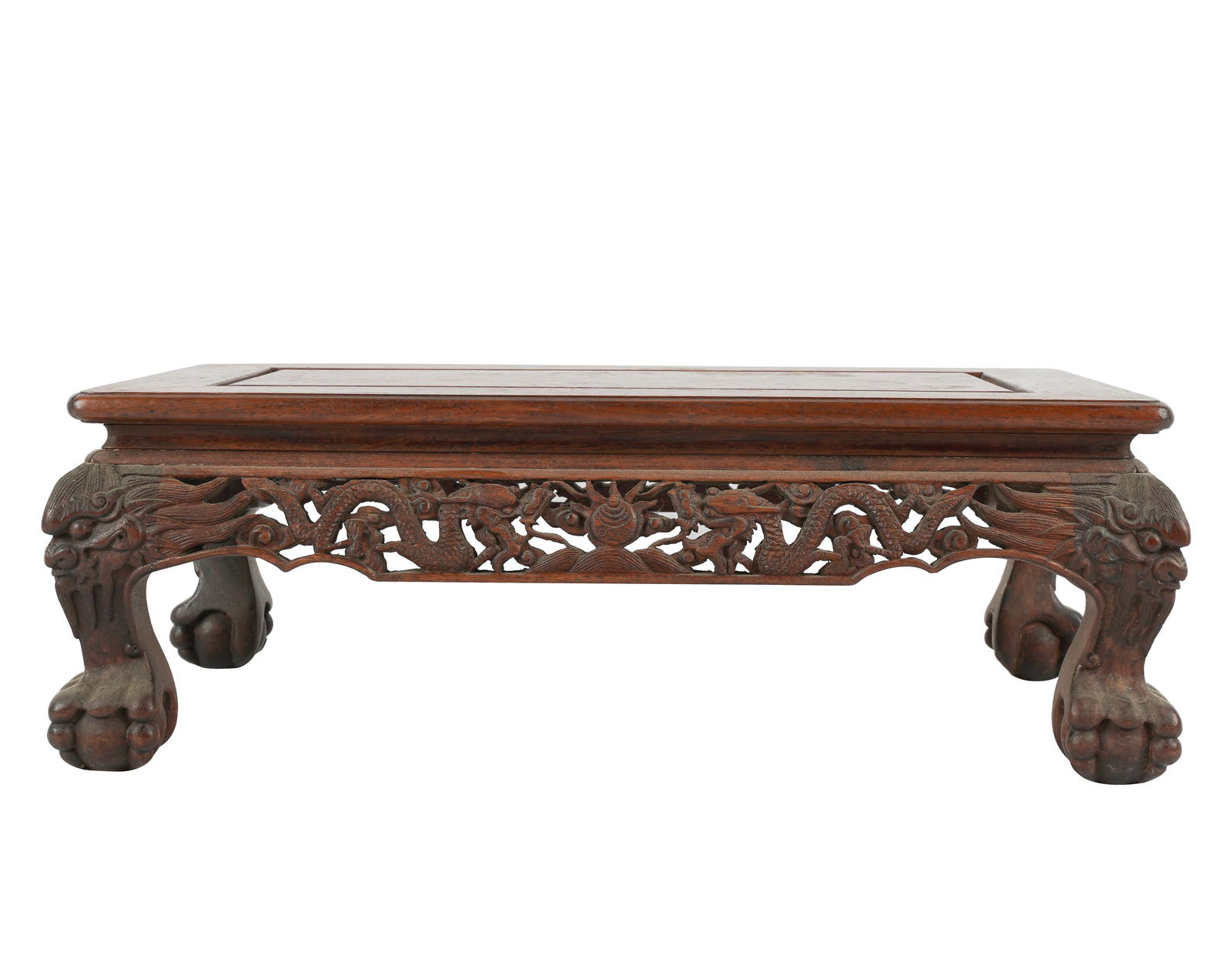 CHINESE CARVED WOOD STAND: with dragon motif; resting on ball and claw feet; Provenance: The Estate of Barbara Beretich, Artist and Collector of Art, Claremont, CA; 15 1/4 inches wide; 9 1/4 inches deep; 5 inches high