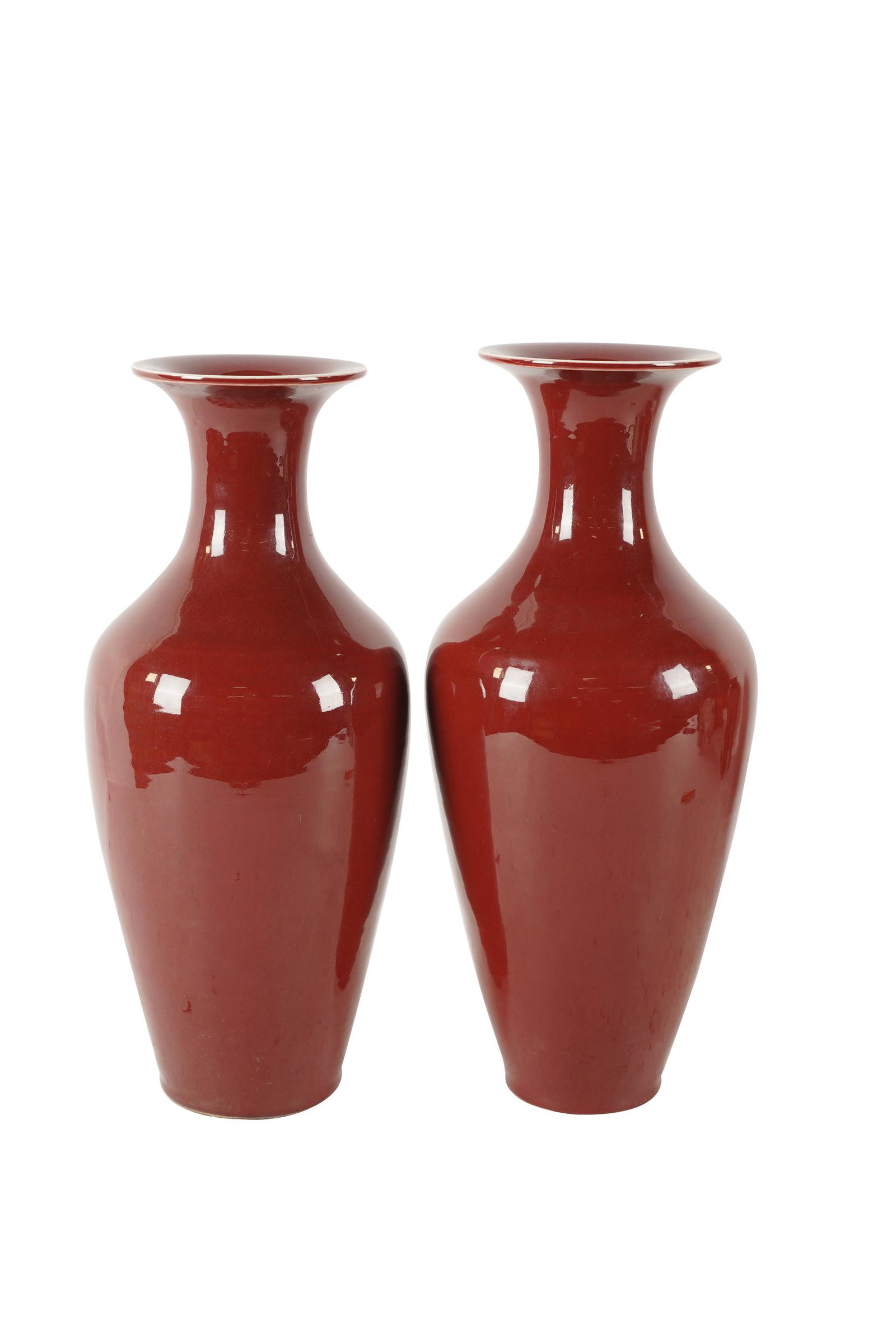 PAIR OF CHINESE SANG DE BOEUF PORCELAIN VASES: unsigned; each 15 1/2 inches high