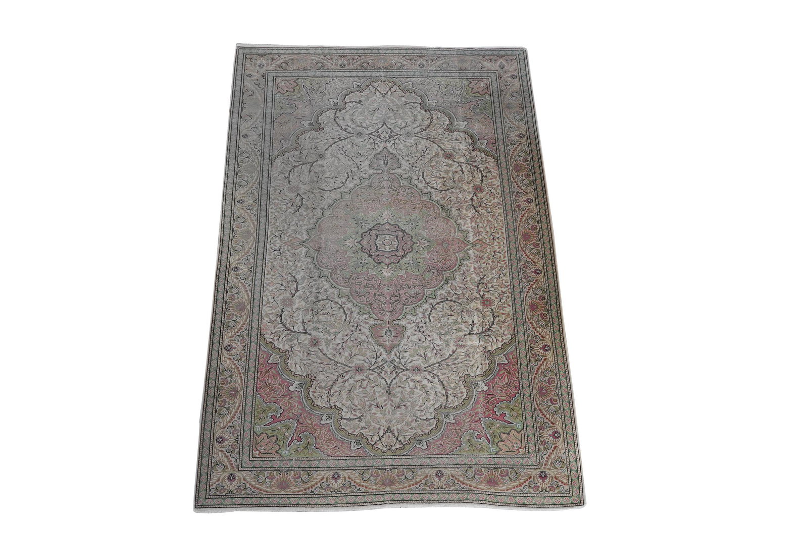 PERSIAN-STYLE AREA RUG: wool; predominantly pink and green; 9' 6 1/2'' x 6' 6''