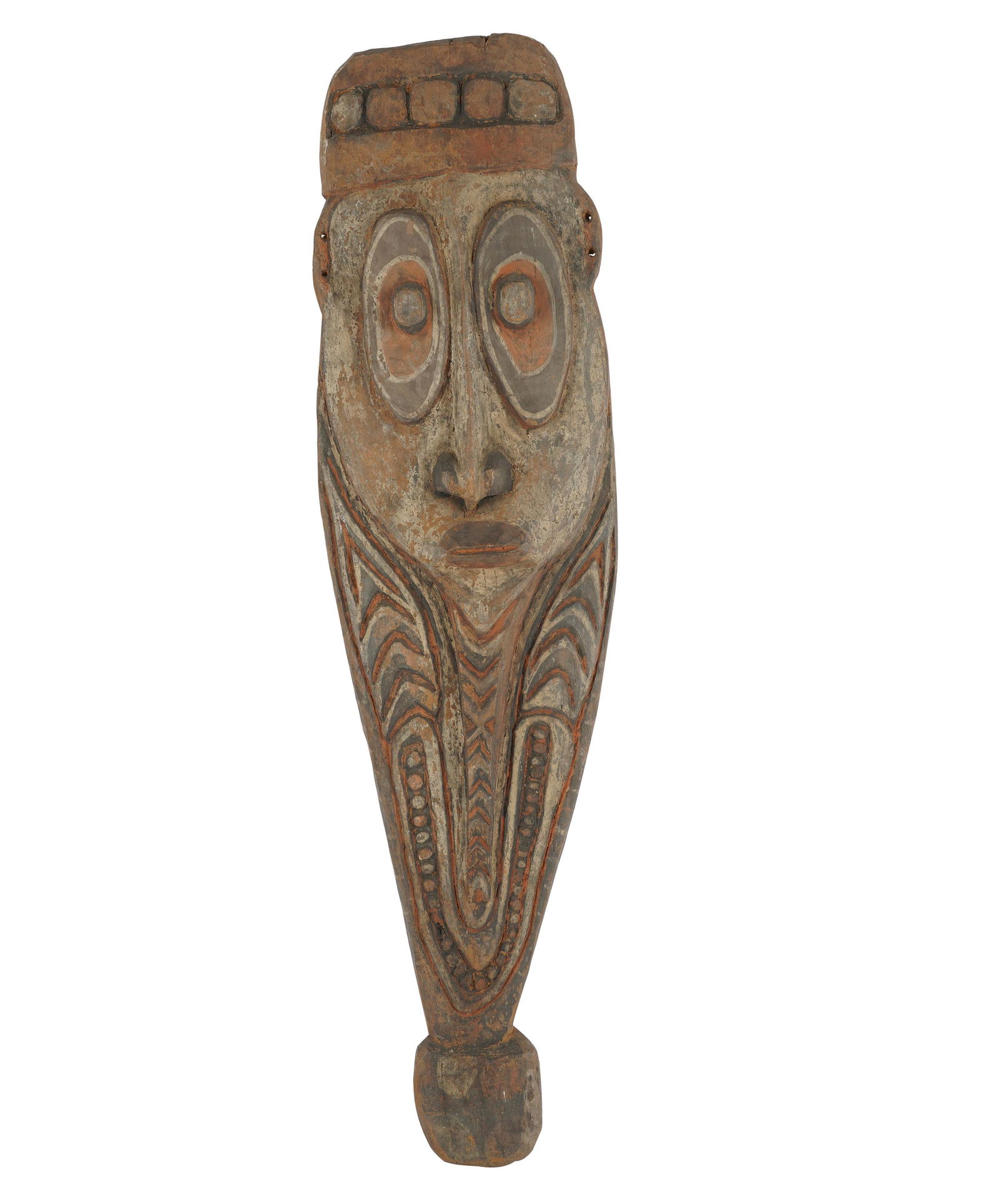 NEW GUINEA POLYCHROMED WOOD CARVING: in the shape of a mask; Provenance: The Estate of Arthur and Doris Glick, Beverly Hills; 42 1/4 inches high