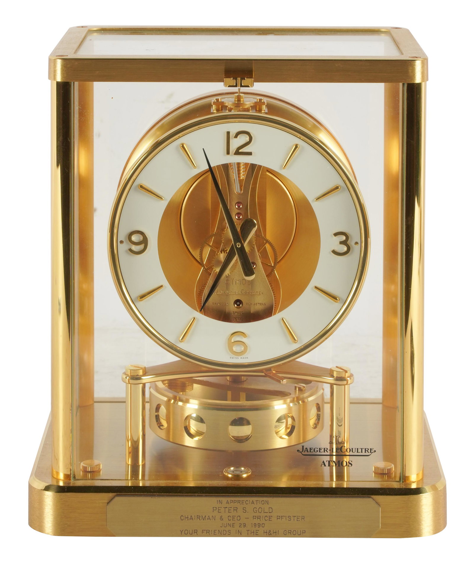 JAEGER-LECOULTRE ATMOS CLOCK: brass and glass; 13 jewels; with dedication plaque to front of base; Condition: working condition untested and unknown; a light scratch to rear glass panel; faint scratches to glass; 8 inches wide; 6 