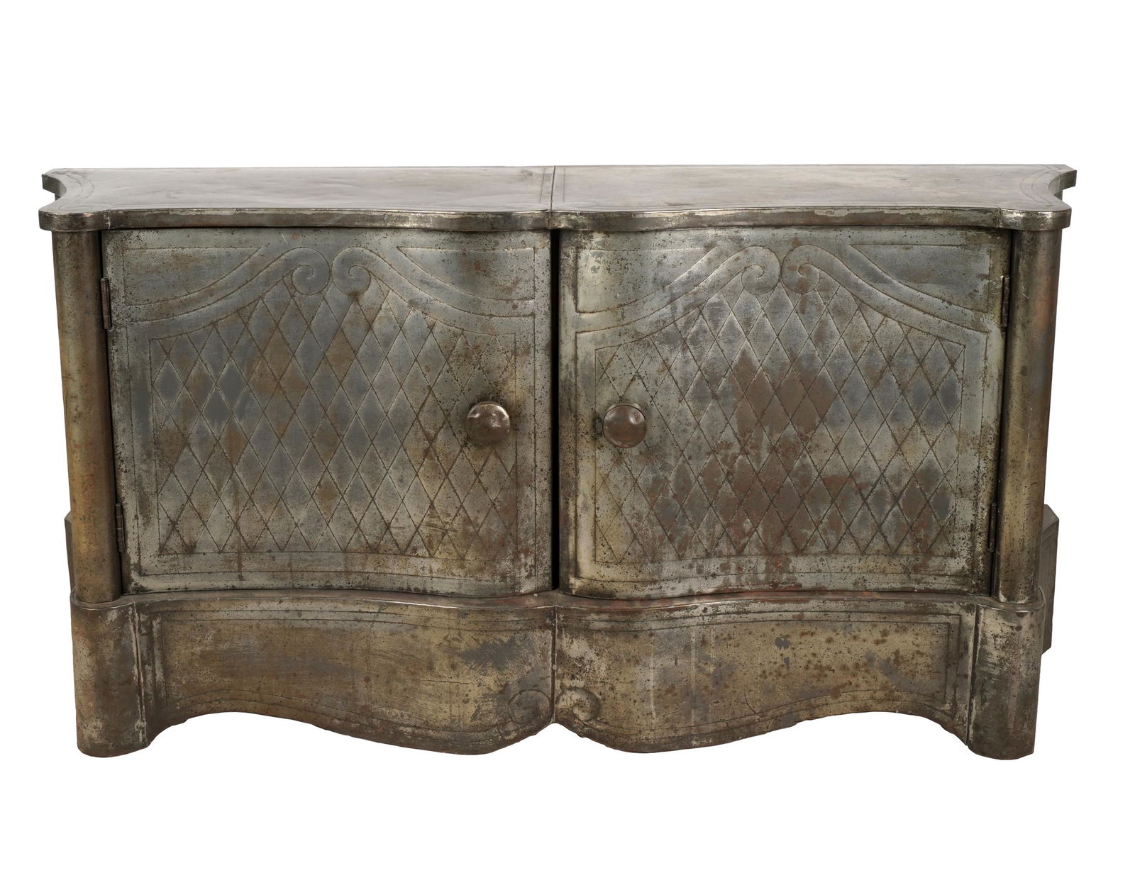 VENETIAN-STYLE ZINC-CLAD CREDENZA: of serpentine outline; the pair of doors enclosing a shelf on the left-hand side; Provenance: The Jim Belushi Collection, a Michael Smith Installation; 59 inches wide; 18 inches deep; 29 inches high