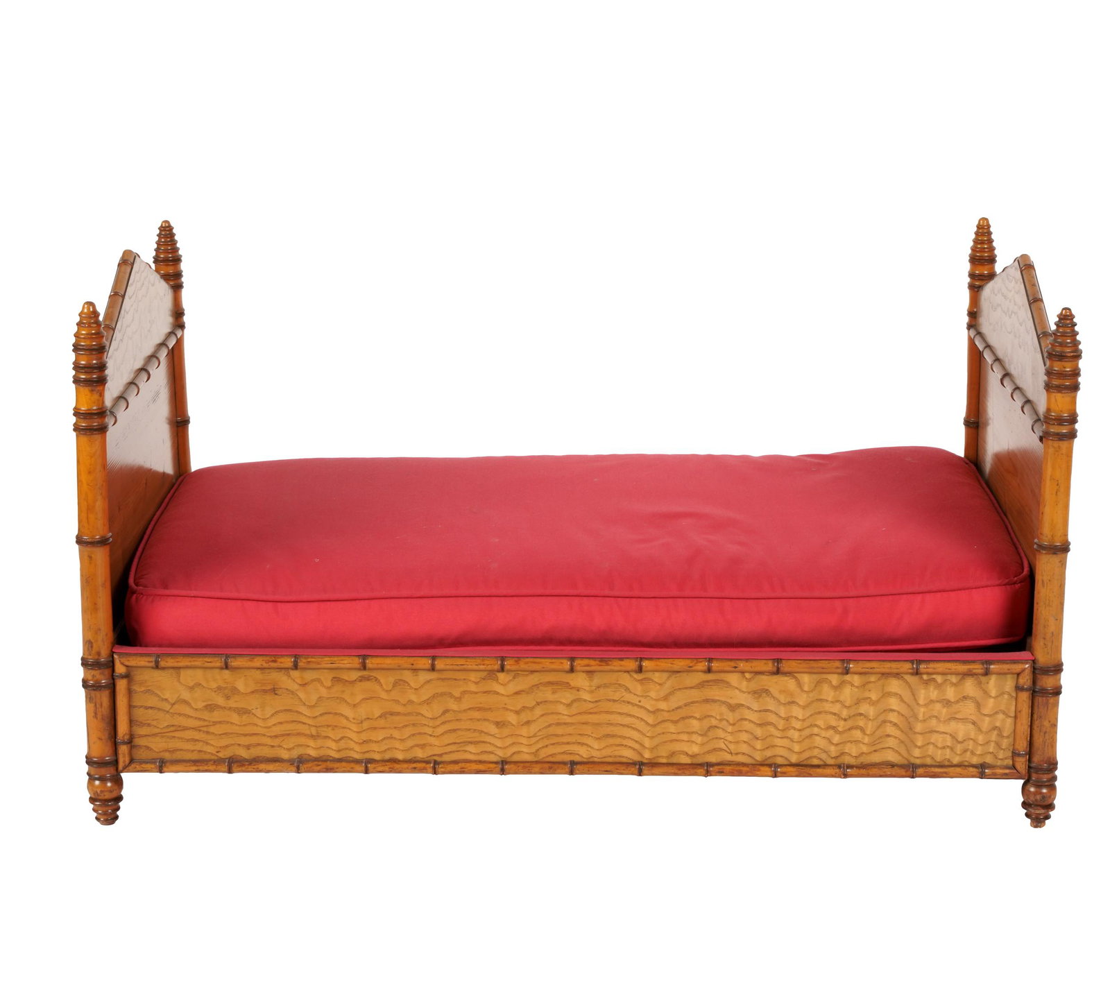 DIMINUTIVE FAUX-BAMBOO BED: with loose fabric-covered cushion and two bolsters; Provenance: The Estate of James and Lois Garner; proceeds will benefit Childrenâ€™s Hospital Los Angeles and World Wildlife Fund; 34 inches wid