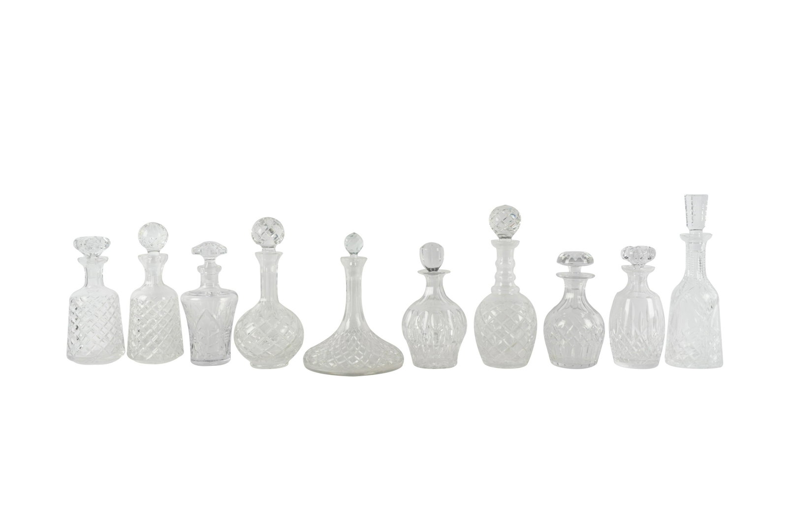 COLLECTION OF TEN CUT-CRYSTAL DECANTERS: unsigned; Provenance: The Estate of Carol Mae Fries, Ojai, California; ranging from 9 to 13 1/2 inches high