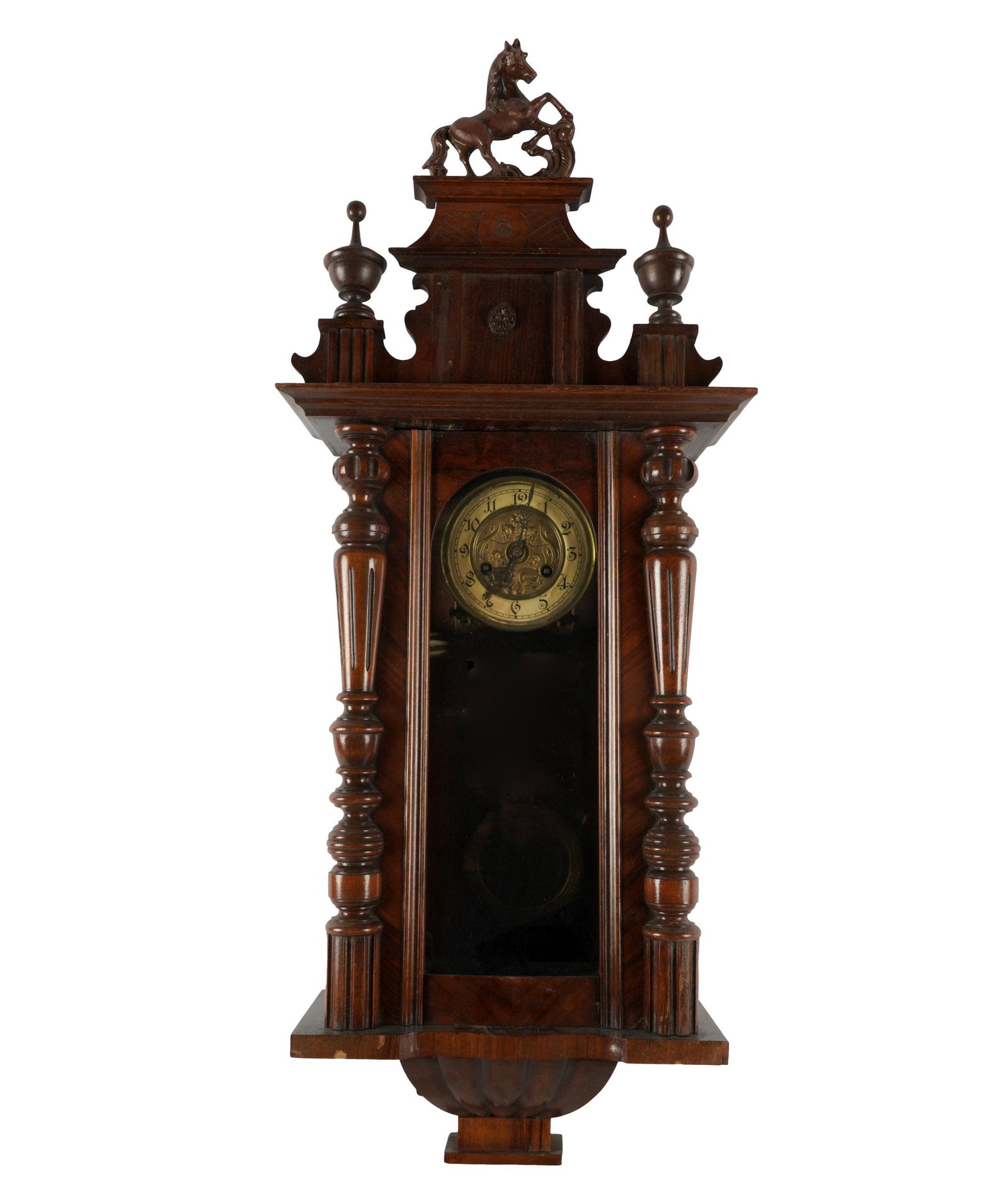 CARVED MAHOGANY WALL CLOCK: unsigned; the pediment surmounted by a horse; 17 inches wide; 8 inches deep; 38 inches high