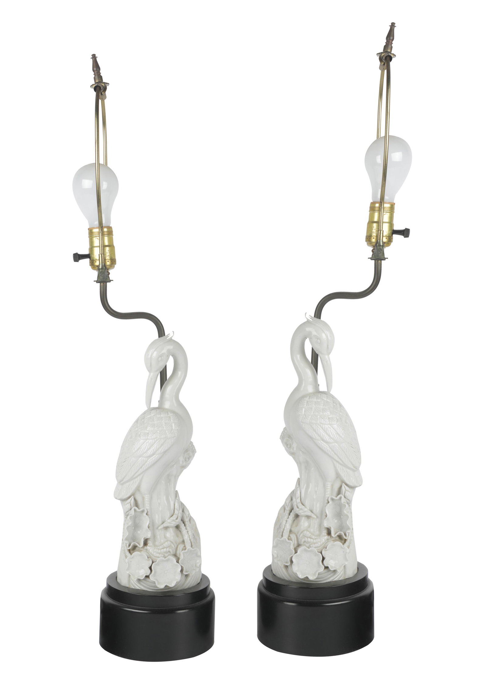 PAIR OF CHINESE PORCELAIN CRANES: each fitted as a lamp on wood base; 4 1/2 inches wide; 12 inches high; 29 inches high overall