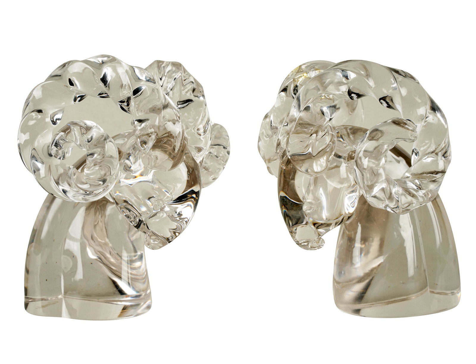 TWO CARTIER CRYSTAL RAM'S HEADS: each signed to underside; Condition: no chips or cracks; 5 1/4 inches wide; 6 1/2 inches high