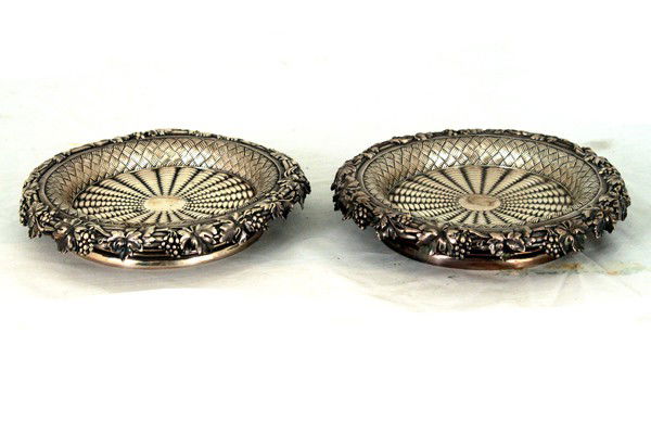 PAIR OF VICTORIAN SILVER WINE COASTERS: Robert Garrard, London, 1853-54 the cast grapevine rim on a basketweave body 28 total troy ounces 7 3/4 inches diameter