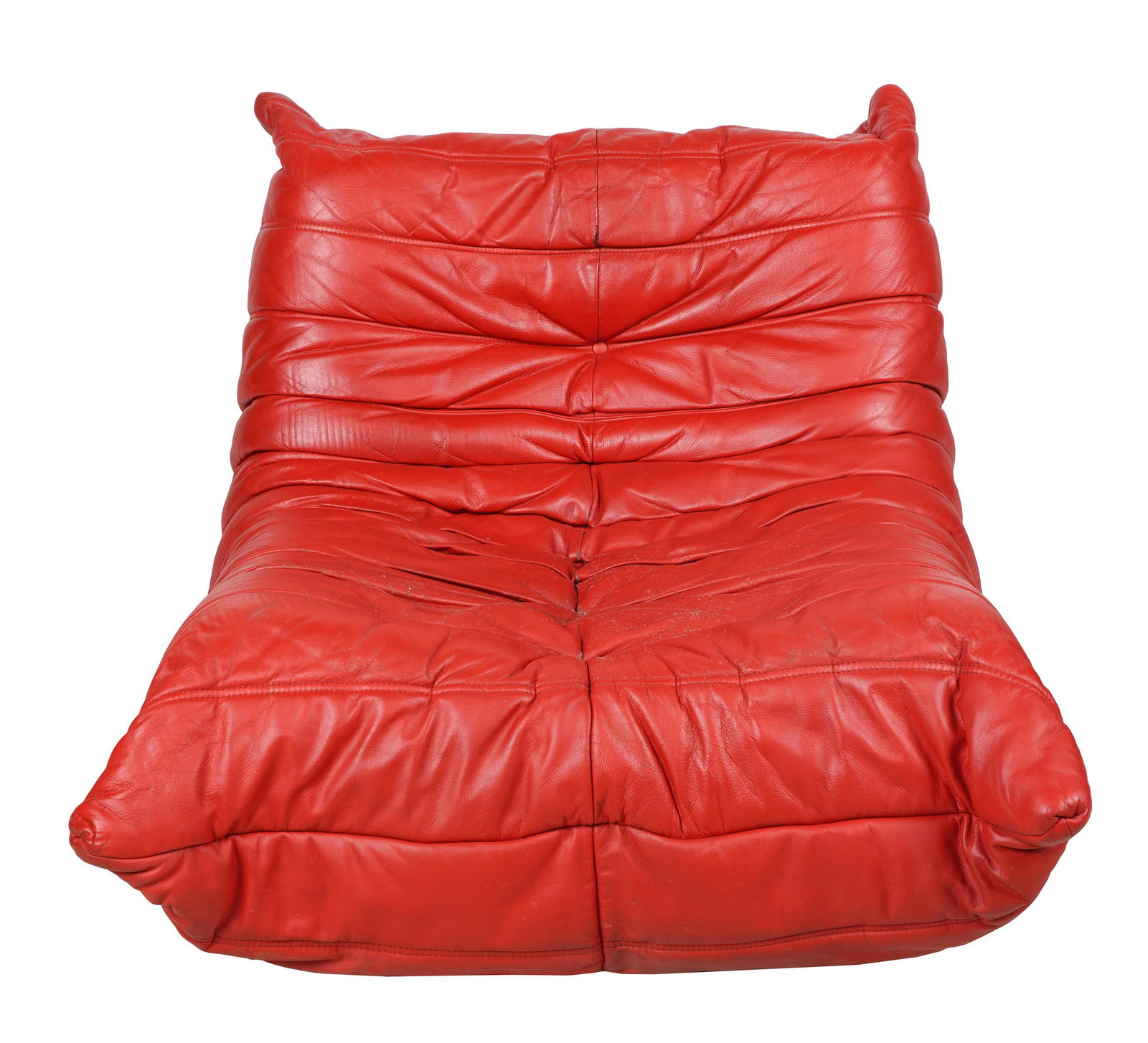 MICHEL DUCAROY FOR LIGNE ROSET "TOGO" LOUNGE CHAIR: with label "Ligne Roset, Made in France"; covered with red leather; 35 inches wide; 40 inches deep; 27 inches high