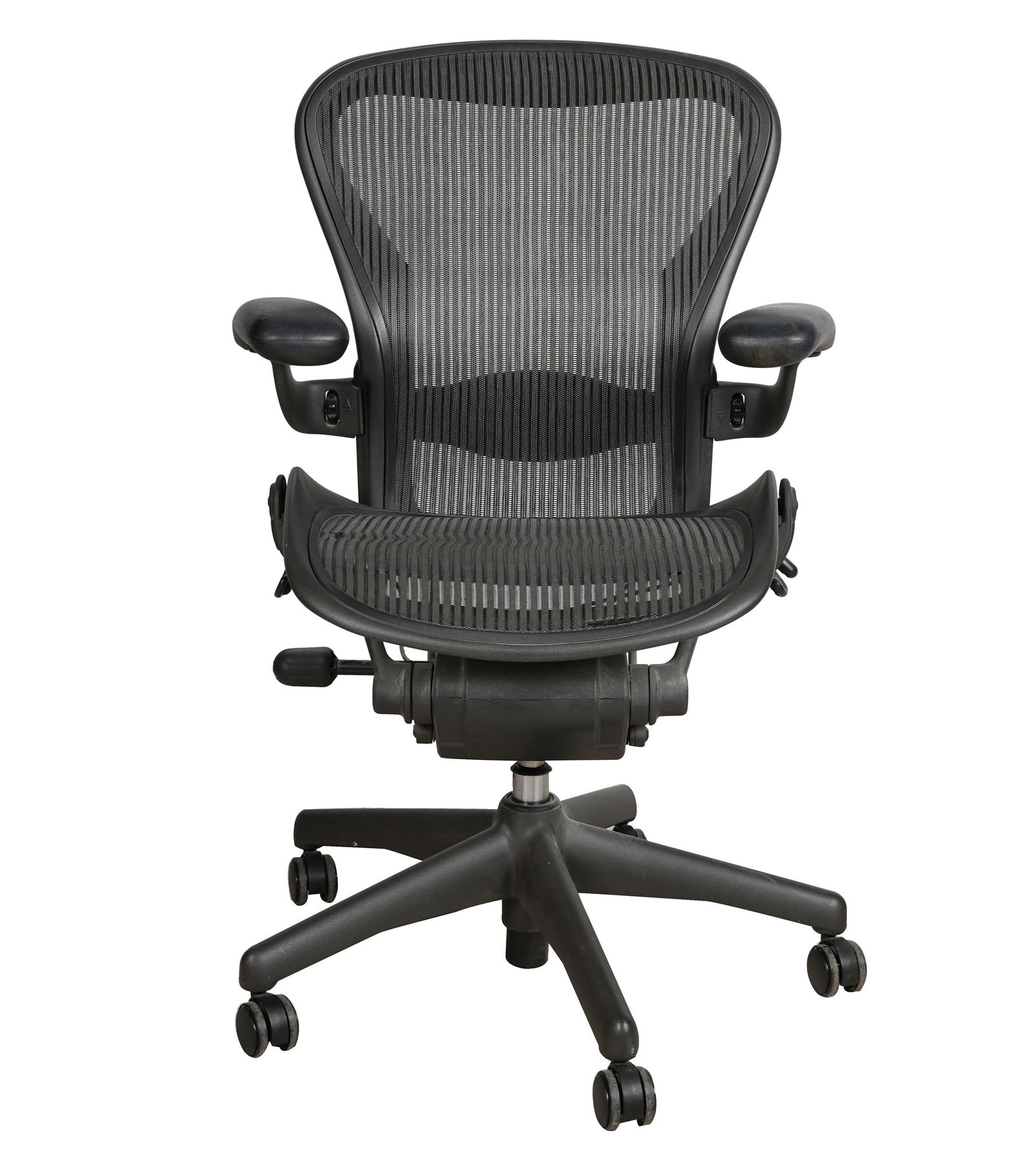 HERMAN MILLER "AERON" OFFICE CHAIR: black plastic and metal; molded Herman Miller label; Condition: tears to webbing on seat; two wheels not functioning (may need oiling); 27 1/4 inches wide; 24 1/2 inches deep